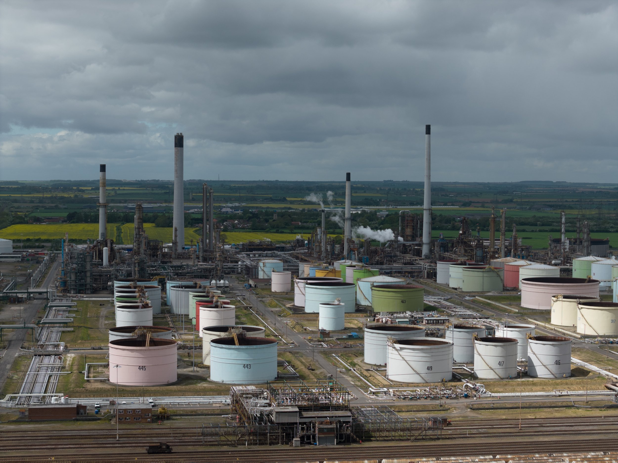 Immingham oil refinery in Lincolnshire, England with industrial storage tanks, port and energy infrastructure.