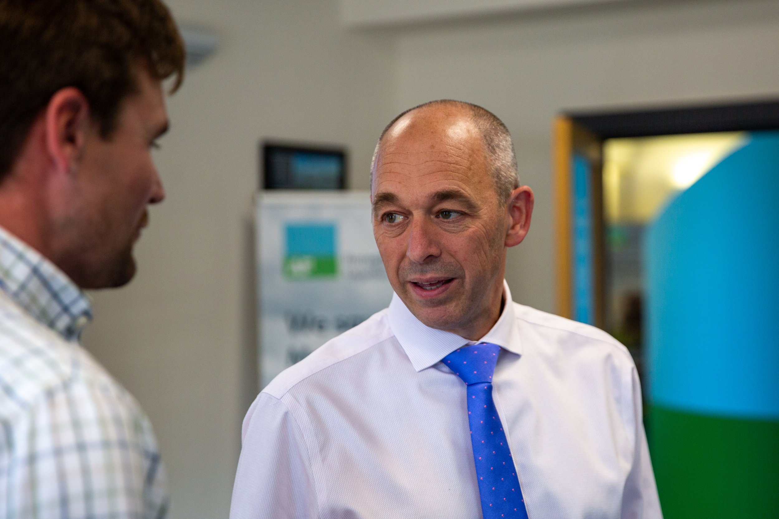AF Chief Agricultural Officer John Barrett speaking with an AF Member.